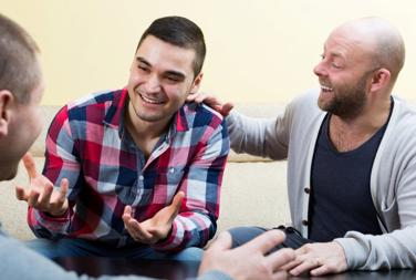 Brothers All Sat Together Talking And Having A Conversation