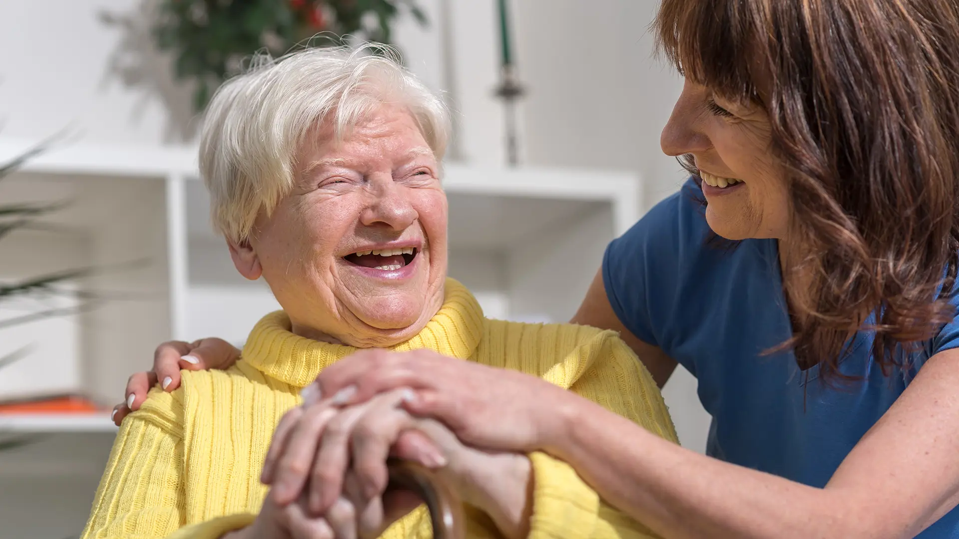 Older Woman Laughing With Other Woman